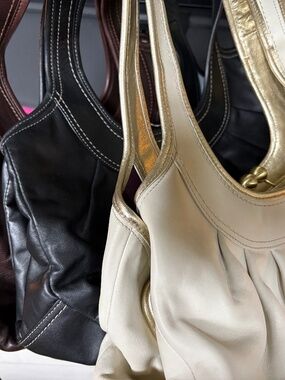 Three Coach Kisslock leather bags. Like new condition. White Rock, BC
